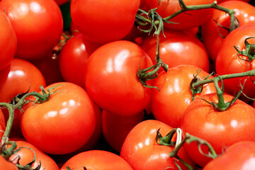 Bright red tomatoes close-up, background or texture