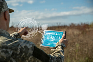 AI technology in the army. Warfare analytic operator checking coordination of the military team....