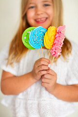 Cute little girl with candies pop