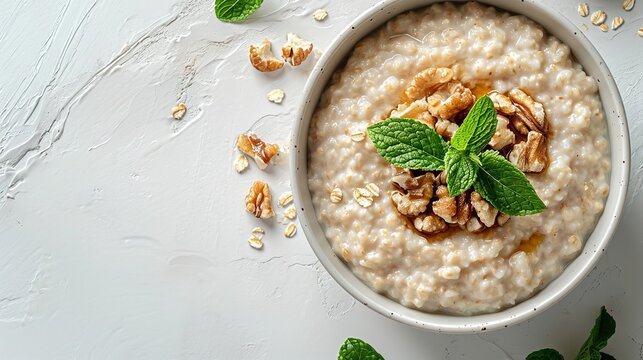 A white background features a bowl of oatmeal porridge with syrup on top, big space, Generative AI.