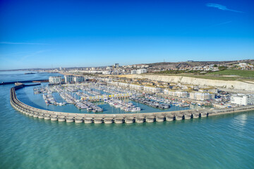 Brighton Marina in East Sussex, Southern England, with chalk cliffs and Brighton City in the background, Aerial view from the sea.