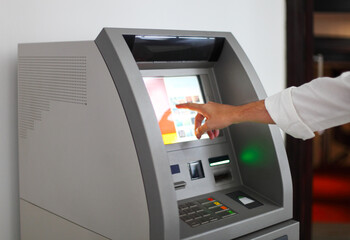 Man using banking machine