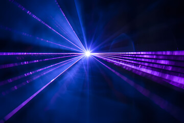 Blue and violet beams of bright laser light shining background