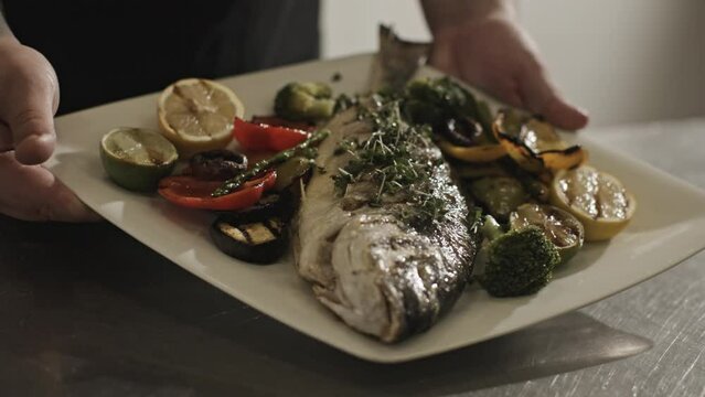 Fresh White Plate With Grilled Fish and Colorful Veggies