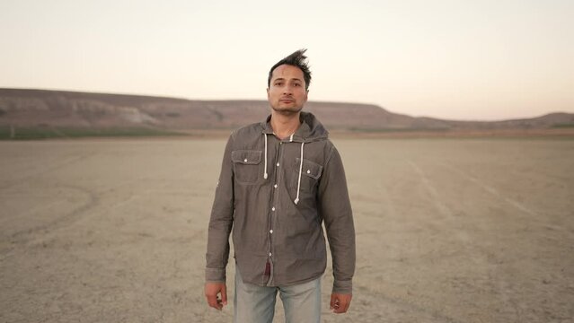 Wandering through a serene desert landscape at dusk, a soul-searching journey