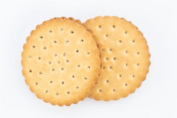 Stacked sandwich biscuits with pink cream filling  on white background.