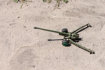 Toy metal artillery cannon 100-mm field gun. Top view. Copy space