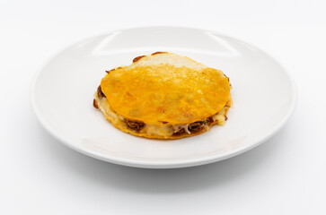 Birria mulitas on a white plate