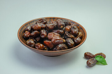 Dates in a plate on a light background