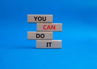 You can do it symbol. Concept words You can do it on wooden blocks. Beautiful blue background. Business and You can do it concept. Copy space.
