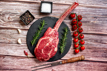raw steak
Tomahawk on wooden background