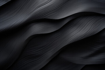Obraz premium Abstract black fabric texture background with soft waves pattern