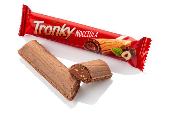 Alba, Italy - January 20, 2024: Tronky hazelnut Ferrero wafer in the shape of a tree trunk filled with chocolate hazelnut cream, package and cookie cut isolated on white, clipping path included