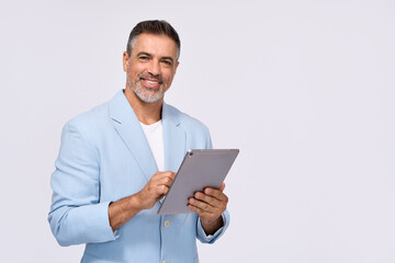 Happy middle aged business man ceo wearing suit standing isolated on white using digital tablet. Smiling mature businessman professional executive manager looking at camera holding device. Portrait
