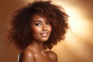 Beautiful  smiling African American woman with healthy skin and curly hair.