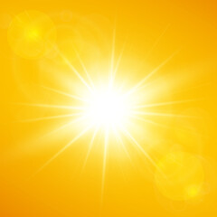 Summer background with bright sunshine and lens flare on yellow and orange