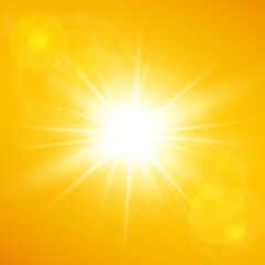 Summer background with bright sunshine and lens flare on yellow and orange