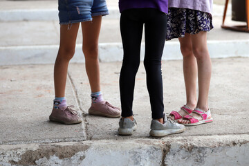 
Girls playing together in the school yard. Friends chatting in a circle. Concept of friendship,...