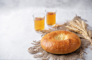 Sesame seeds round bun on a white background