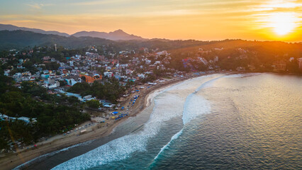 Aerial of riviera Nayarit in Mexico Pacific Ocean surf spot at sunset 