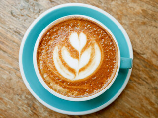 A cup of coffee latte art with steamed milk