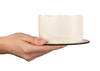 Hand holding blank simple bento cake, cream mockup isolated on white