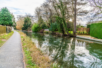 Fototapeta na wymiar A view away from town along the towpath beside the frozen Grand Union canal in Market Harborough in Winter