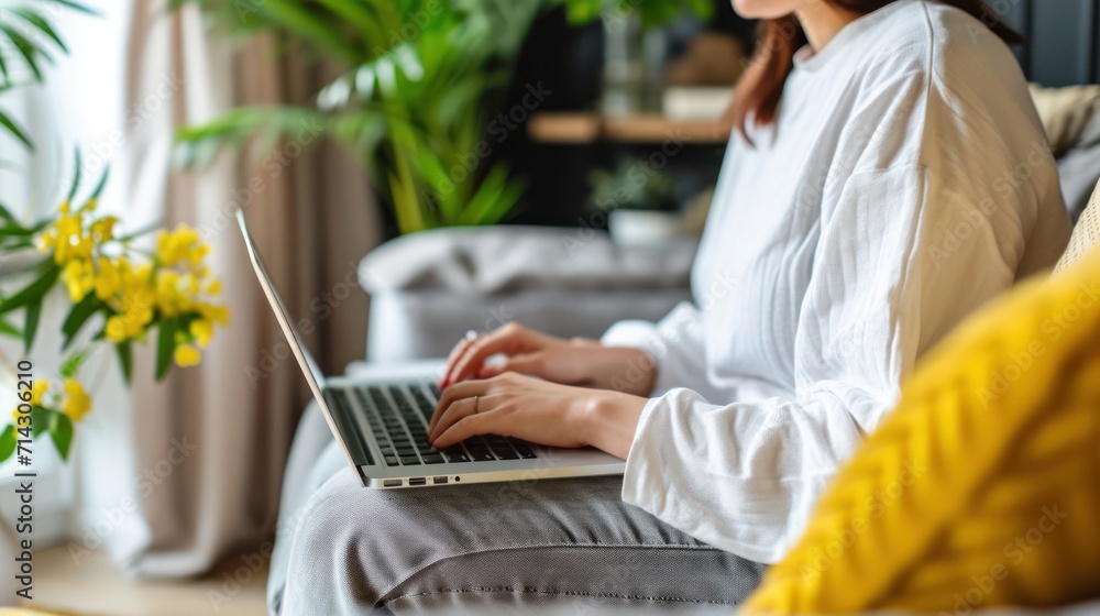 Poster woman sitting on couch using laptop computer for typing generative ai