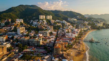 Fototapeta na wymiar Aerial of Puerto Vallarta Mexico Nayarit pacific coastline at sunset with waterfront hotel in the romantic zone