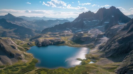  an aerial view of a mountain range with a lake in the foreground and a lake in the middle of the mountain range in the middle of the foreground.