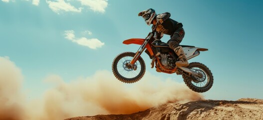 a motorcyclist doing stunts while on his dirt bike