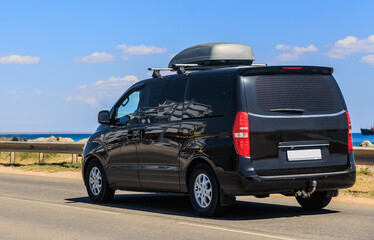 van moving along the seashore