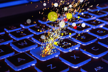 Sparks from laptop keyboard.