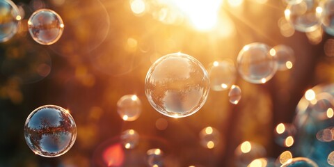 Abstract beautiful transparent soap bubbles floating on sunset background, romantic outdoor park backgrounds.