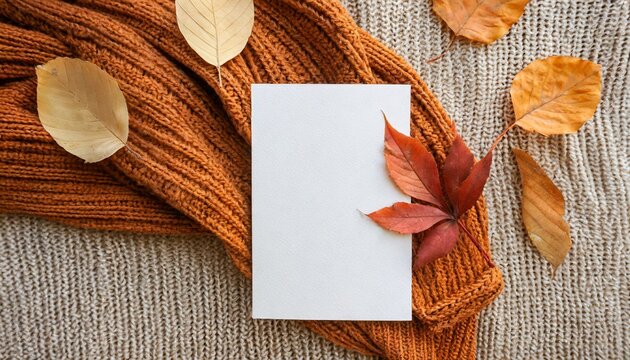 aesthetic autumn wedding invitation business brand design template flat lay blank paper card mock up fall leaves on neutral beige and bright ginger orange knitted textile background