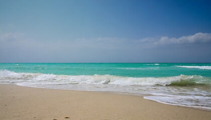 Fototapeta premium closeup of sandy beach with turquoise sea and sky background high quality photo