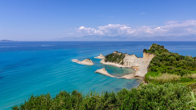 Cape Drastis cliffs near Sidari and Peroulades on Corfu island in Greece. Famous rock formations with small beach and rugged coastline. Popular Greek destination for summer vacation