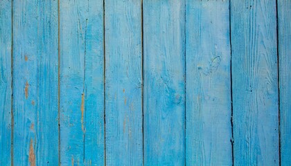 light blue old wooden background of boards old worn cracked paint bright saturated color