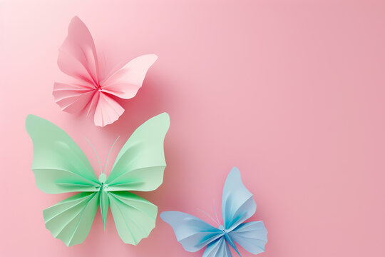 Delicate origami butterflies in shades of pink, green, and blue, a creative representation for Rare Disease Day..