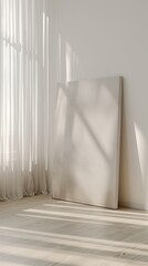 A minimalist living room with a large, empty plain canvas frame leaning against a clean, white wall. Soft natural light filters through sheer curtains, highlighting the frame's texture