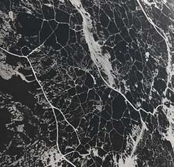 Stone mosaic background. Black stonewall. Rock texture with cracks. Close-up. Rough Stone surface. Beautiful nature backdrop with empty copy space 