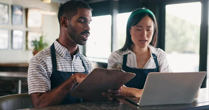 Business owner, teamwork and computer for restaurant profit, sales and stock inventory management on a checklist. Man, waiter and manager with documents, laptop and planning budget in a startup cafe