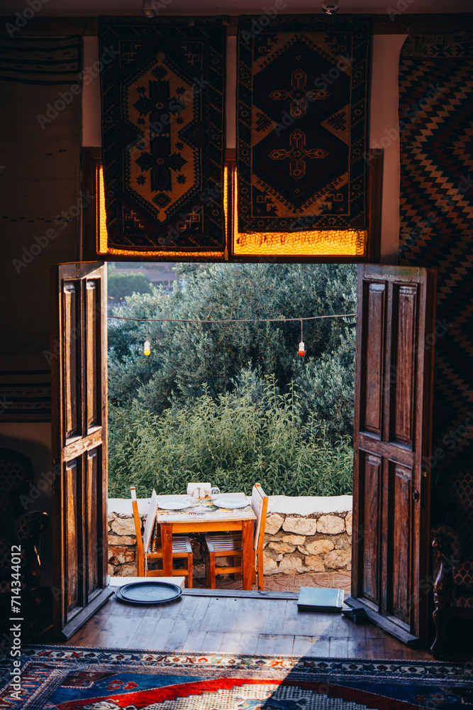 Wall mural Outdoor cafe or restaurant tables in ottoman style in the old city of Kas, Turkey. - Wall murals