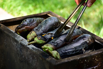 cooking eggplant on a charcoal barbecue