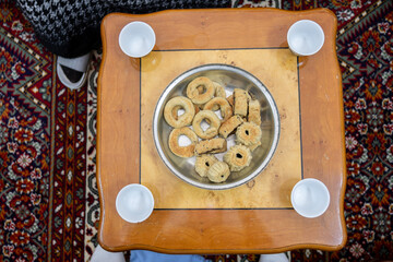 Eid kahk on table with coffee cups