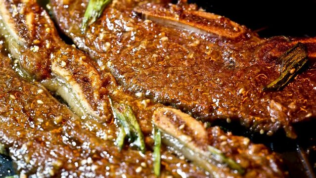 Dolly Shot of Kalbi, Short Rib Marinated in Soy Sauce and Garlic - 4K Ultra HD Grilling Video, Korean Style