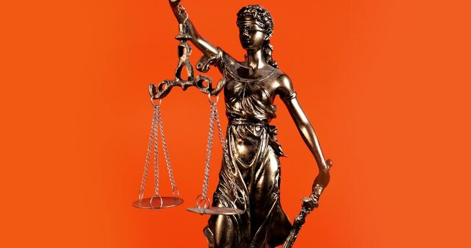 Lady Justice Against A Solid Orange Color