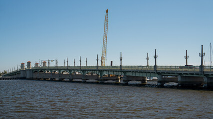The Bridge of Lions spans a river in Saint Augustine, Florida, on a clear winter day.