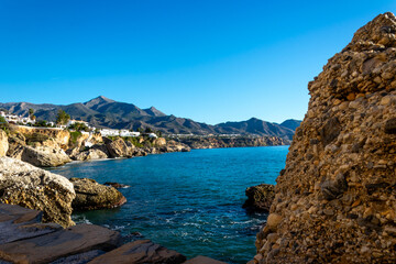 View of the beautiful city of Nerja. Andalusia, Spain. Panorama of the sea, city and mountains.