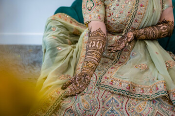 Indian bride's henna mehendi mehndi hands close up